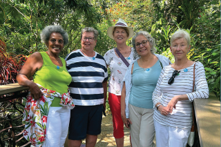 Group of women standing together smiling