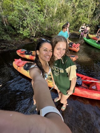 Two students in the water taking a selfie