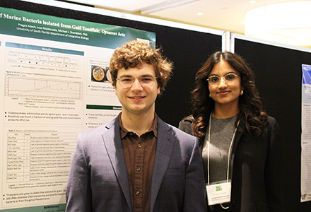 Jose Maldonado and Pragati Adesh in front of poster presentation