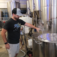Student working at brewing during internship in the Brewing Arts program.