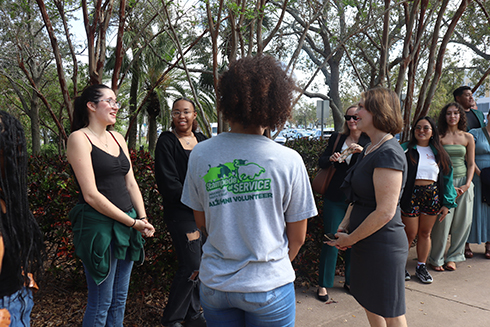 Cathy Castor speaking to a small group of students