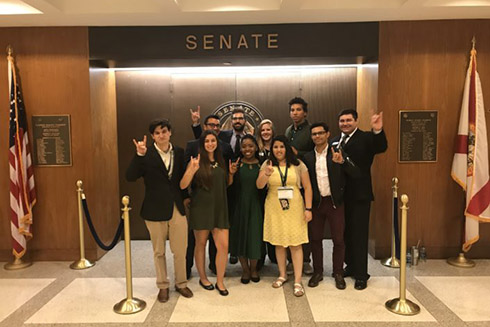 Students posing in the Senate while visiting Tallahassee