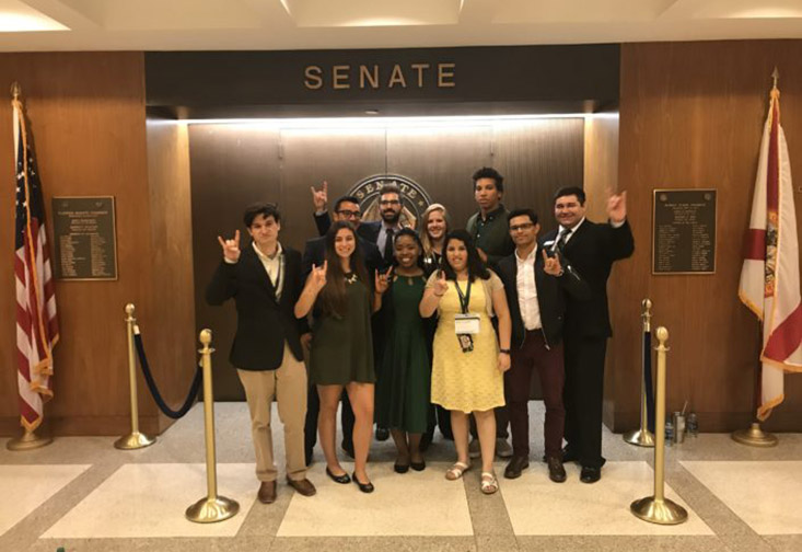 Students posing in the Senate while visiting Tallahassee