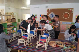 Dr. LaSonya Moore participating in an activity with her students in China.