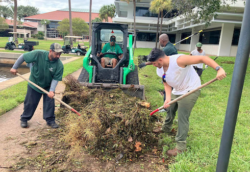 USF St. Petersburg facility team members work to cleanup hurricane debris on campus.