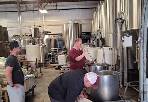 Intern looks on during a brewing session.