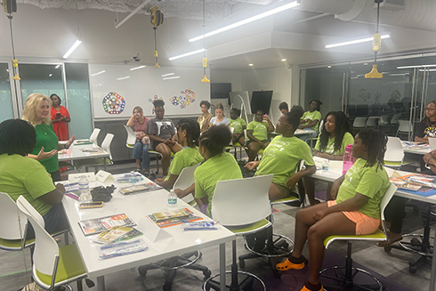 kids attending the She Draws Summer Camp in a classroom on USF St. Petersburg campus