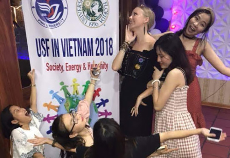 Emma Roberson and Minh Anh Nguyen take part in the opening ceremony for the education abroad program in Vietnam. 