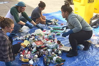 USFSP students separating waste to recycle.